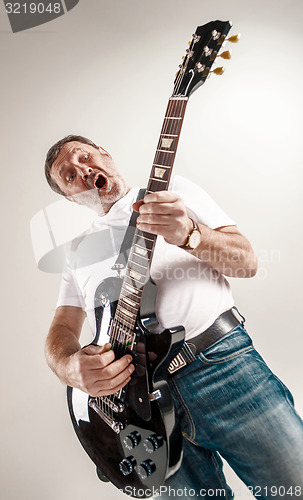 Image of portrait of a guitar player 