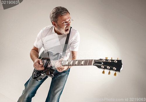 Image of portrait of a guitar player 