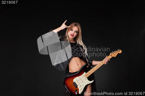 Image of Beautiful girl playing guitar