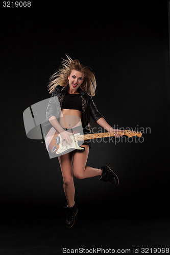 Image of Beautiful girl playing guitar