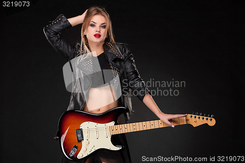 Image of Beautiful girl playing guitar