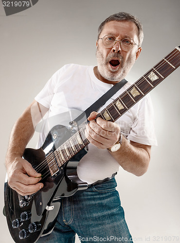 Image of portrait of a guitar player 