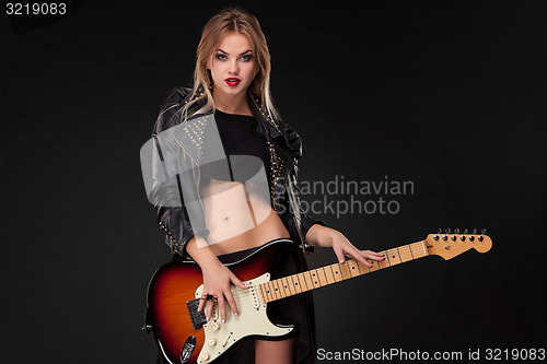 Image of Beautiful girl playing guitar