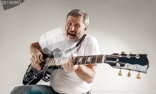 Image of portrait of a guitar player 