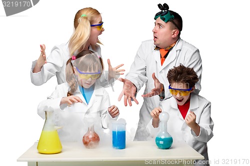 Image of Teens and teachers of chemistry at  lesson making experiments