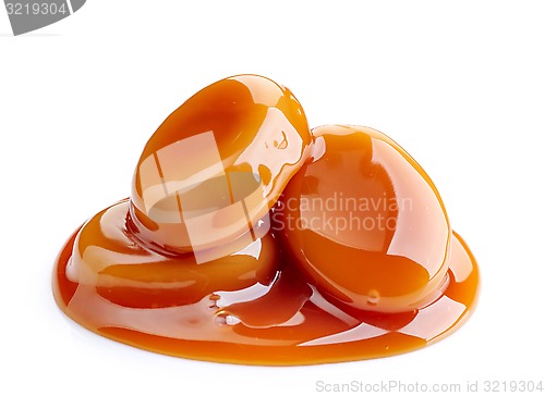 Image of caramel candies and sauce