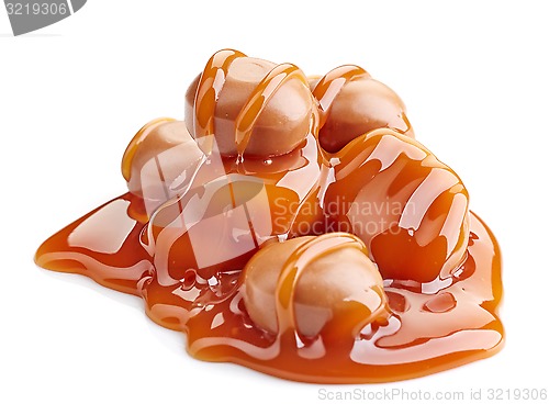 Image of caramel candies and sauce