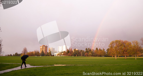 Image of Rainbow Appears Over Park During Thunderstorm Pedestrian Umbrell