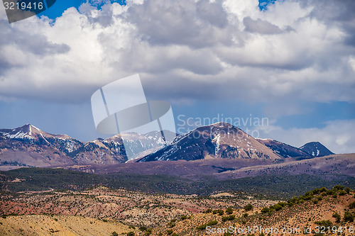 Image of canyon badlands and colorado rockies lanadscape