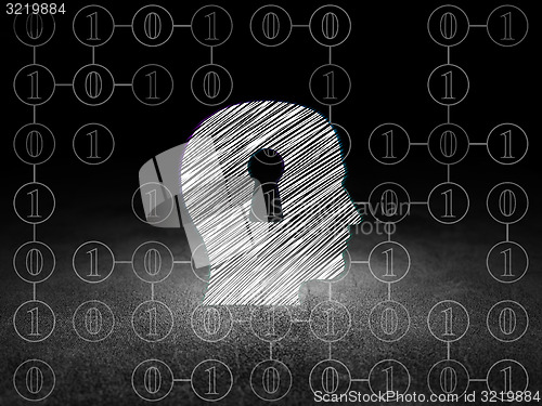 Image of Finance concept: Head With Keyhole in grunge dark room