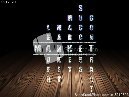 Image of Finance concept: word Market in solving Crossword Puzzle