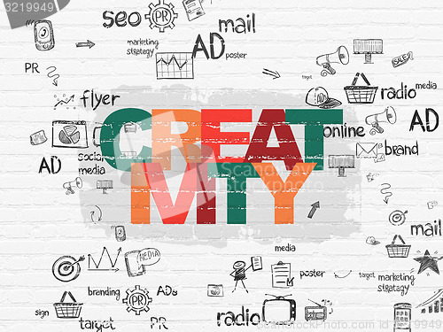 Image of Marketing concept: Creativity on wall background