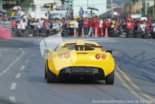 Image of Racing car and spectators