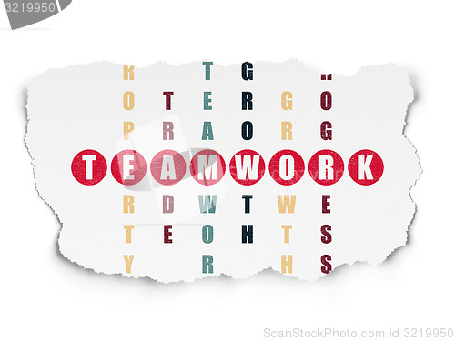 Image of Finance concept: word Teamwork in solving Crossword Puzzle