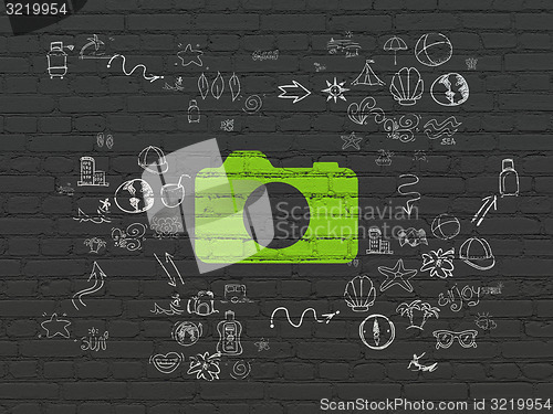 Image of Vacation concept: Photo Camera on wall background