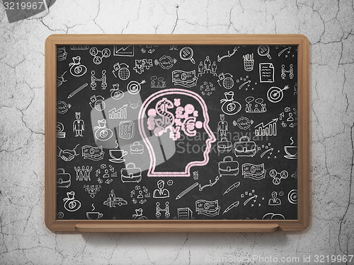 Image of Business concept: Head With Finance Symbol on School Board background