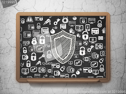 Image of Safety concept: Shield on School Board background