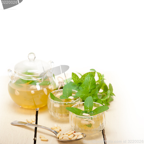 Image of Arab traditional mint and pine nuts tea