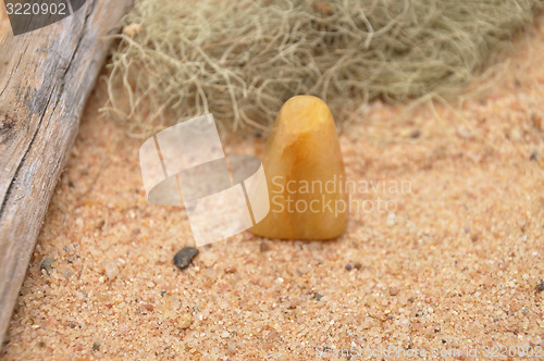 Image of Orange calcite on beach