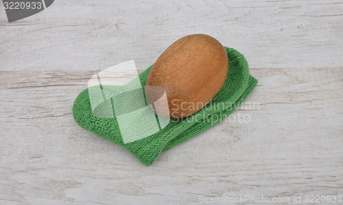 Image of Darning egg and hand-knitted sock