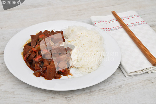 Image of Dish with chopsticks