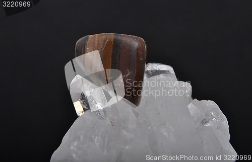 Image of Tiger iron on rock crystal