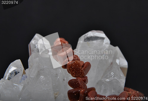 Image of Goldstone on rock crystal