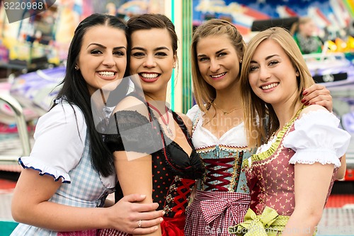 Image of 4 gorgeous young women at German funfair