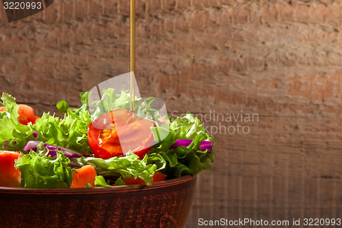 Image of Fresh salade on wooden background