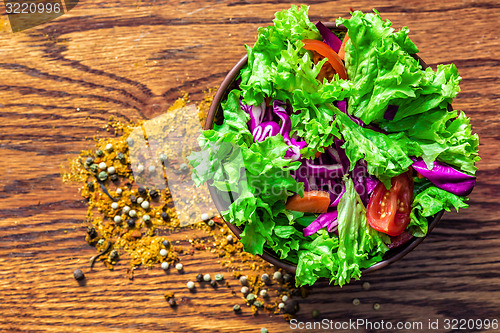 Image of Fresh salade on wooden background