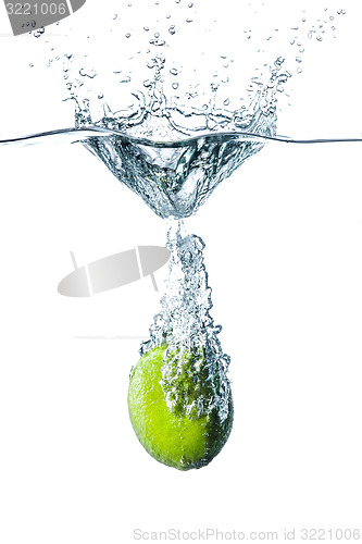 Image of Fresh lime falling into water