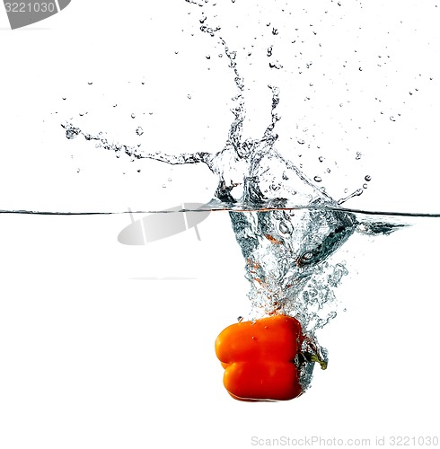 Image of Pepper drops into a water 