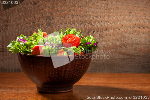 Image of Fresh salade on wooden background