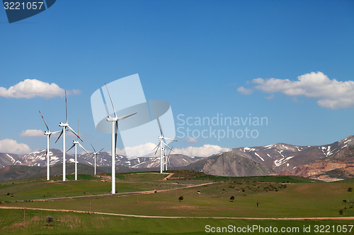 Image of Wind farm at sun spring day