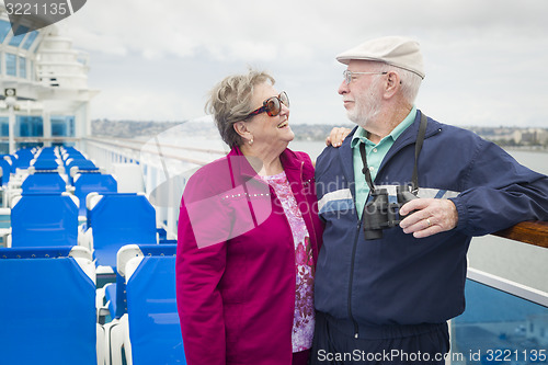 Image of Senior Couple Enjoying The Deck of a Cruise Ship