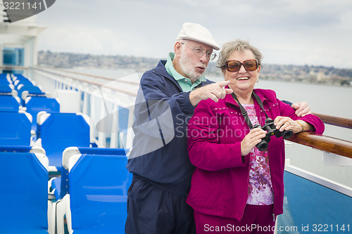 Image of Senior Couple Enjoying The Deck of a Cruise Ship