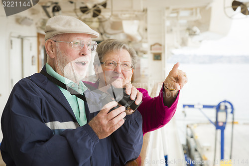 Image of Senior Couple Enjoying The Deck of a Cruise Ship