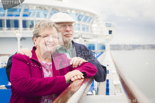 Image of Senior Couple Enjoying The Deck of a Cruise Ship