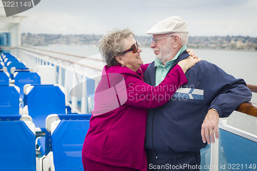 Image of Senior Couple Enjoying The Deck of a Cruise Ship