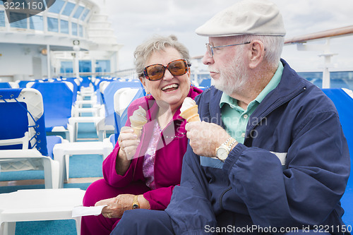 Image of Senior Couple Enjoying Ice Cream On Deck Of Cruise Ship