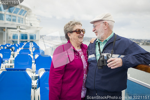 Image of Senior Couple Enjoying The Deck of a Cruise Ship