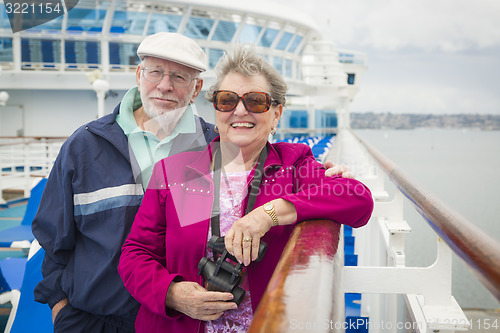 Image of Senior Couple Enjoying The Deck of a Cruise Ship