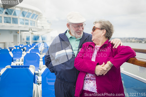 Image of Senior Couple Enjoying The Deck of a Cruise Ship