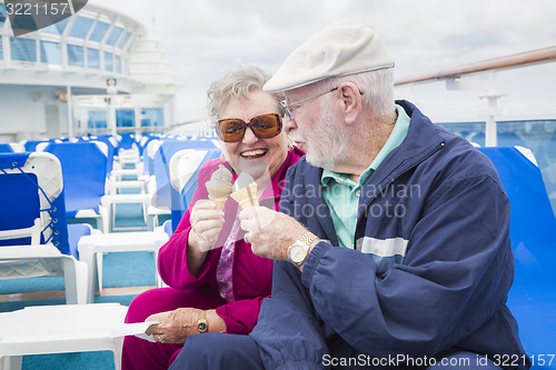 Image of Senior Couple Enjoying Ice Cream On Deck Of Cruise Ship