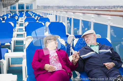 Image of Senior Couple Relaxing On The Deck Of Cruise Ship