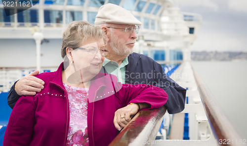 Image of Senior Couple Enjoying The Deck of a Cruise Ship