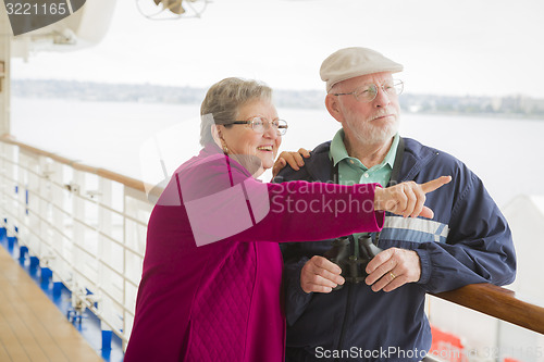 Image of Senior Couple Enjoying The Deck of a Cruise Ship