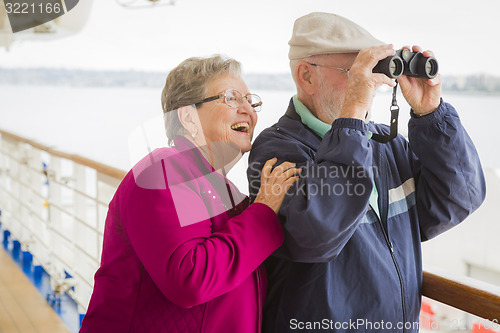 Image of Senior Couple Enjoying The Deck of a Cruise Ship