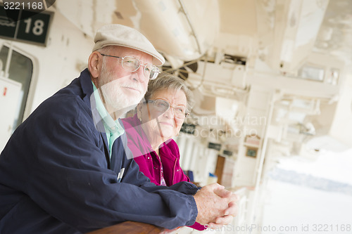 Image of Senior Couple Enjoying The Deck of a Cruise Ship