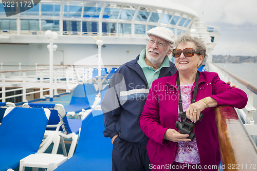 Image of Senior Couple Enjoying The Deck of a Cruise Ship